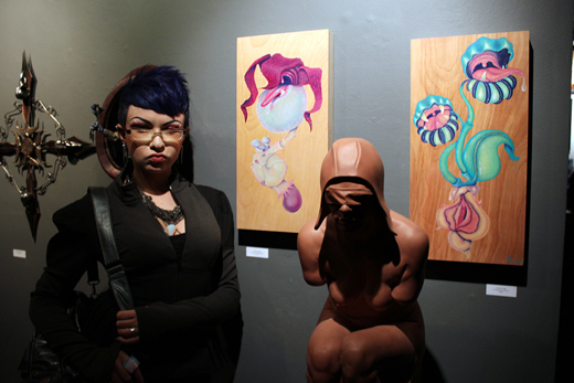 Zoetica Ebb with her paintings at Conjoined 2